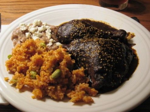 mole-poblano-de-pollo-and-side-dishes-plated.jpg